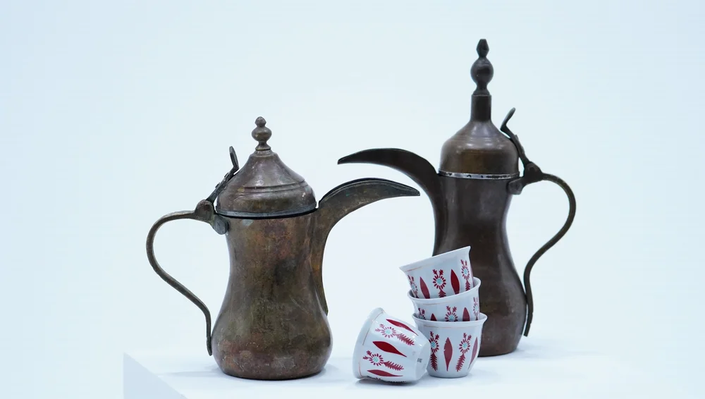 Traditional dallah coffee pots with cups